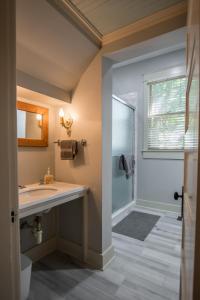 a bathroom with a sink and a shower at Southern Sophistication and Charm in the Heart of Cooper Young in Memphis