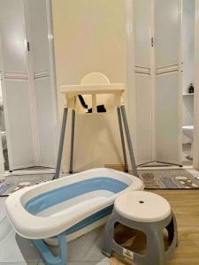 a bathroom with a toilet and a bath tub at Ipoh MU House 27- Muji Style/3BR with ATARI GAME in Ipoh +28 photos