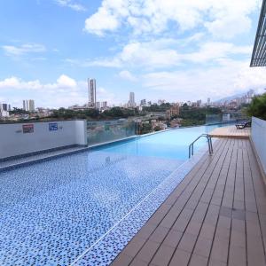 a swimming pool on the roof of a building at Alex & Kamilo in Bucaramanga