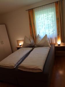 A bed or beds in a room at Appartment Ahorn