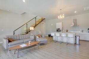 a living room with a couch and a table and a kitchen at Lake Powell Sunrise Villa by Antelope Canyon with firepit and scenic views in Big Water