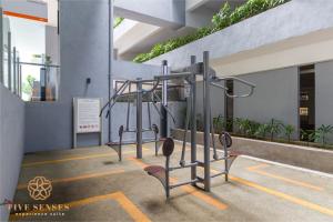 a row of gym equipment in a building at Neu Suites Residence KLCC, Five Senses in Kuala Lumpur