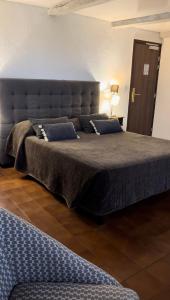 Postel nebo postele na pokoji v ubytování Hotel Maquis et Mer