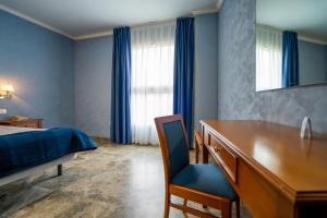 Postel nebo postele na pokoji v ubytování Hotel Bartos