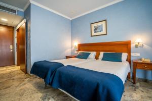 Postel nebo postele na pokoji v ubytování Hotel Bartos