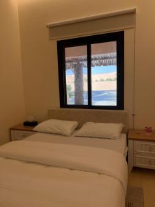 Letto o letti in una camera di Al Artaa Resort