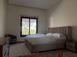 Letto o letti in una camera di Al Artaa Resort