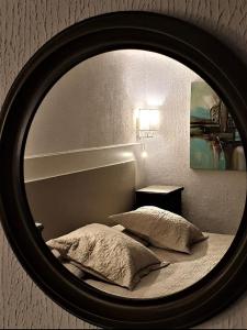 Postel nebo postele na pokoji v ubytování Hotel Maquis et Mer