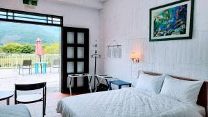 Postel nebo postele na pokoji v ubytování Kelly Field Homestay