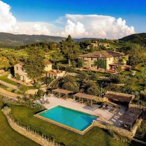 an aerial view of a house with a swimming pool at La Pietra Del Cabreo in Greve in Chianti