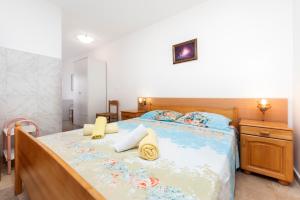 En eller flere senge i et værelse på Luna Tsuki Nine