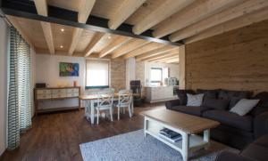 a living room with a couch and a table at Châlets de la Liberté B in Oberstaufen