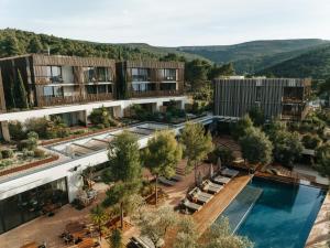 an aerial view of a building with a swimming pool at Maslina Resort in Stari Grad