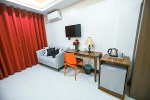 A television and/or entertainment centre at The Suites @ Bellavista