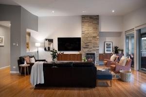 a living room with a couch and a fireplace at Bilsons Landing East in Daylesford