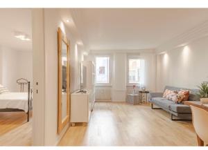 a living room with a couch and a bed at Residenza Cristoforo in Udine