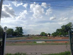 a view of a road with a fence at YaiJaew House in Sukhothai