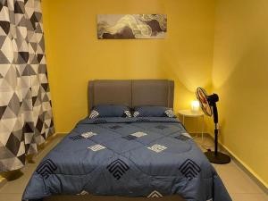 Postel nebo postele na pokoji v ubytování Homestay Raudhah, Taman Gombak Ria