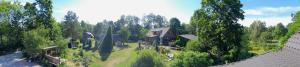 an aerial view of a house in a forest at Uneallika hubane saunaga majake "Hoburaud" in Pae