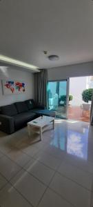a living room with a couch and a coffee table at Casa Lidia Costa Calma beach in Costa Calma