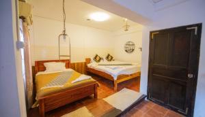 Postel nebo postele na pokoji v ubytování Nammavong Guesthouse