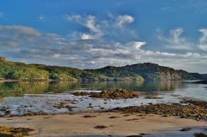 a view of a body of water with mountains at Park House Rooms in Lochinver