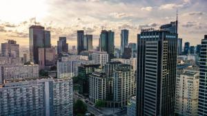 a view of a large city with skyscrapers at Leonardo Royal Hotel Warsaw in Warsaw