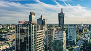 an aerial view of a city with tall buildings at Leonardo Royal Hotel Warsaw in Warsaw