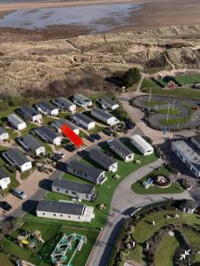 an aerial view of a parking lot with a group of buildings at Presthaven Resort Haven Luxury 2023 Caravan in Prestatyn