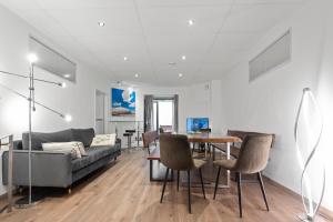 A seating area at Flatista Homes - Garden House