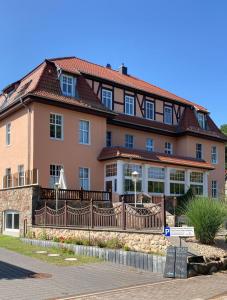 a large house with a fence in front of it at Haus Brandenburg in Stechlin