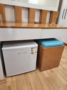 a desk with a drawer and a computer under it at Esperanza Hotel in Antalya