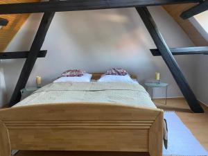 a bedroom with two beds in a attic at Ferienwohnung an der Brigach in Donaueschingen