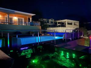 a swimming pool at night with a house at Boost Your Immo Corse Solenzara Tozza Alta 819 in Le Pont du Travo