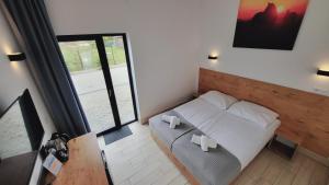 Postel nebo postele na pokoji v ubytování Hotel Konopielka