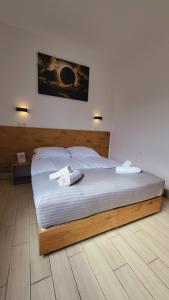 Postel nebo postele na pokoji v ubytování Hotel Konopielka