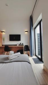 Postel nebo postele na pokoji v ubytování Hotel Konopielka