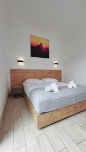 Postel nebo postele na pokoji v ubytování Hotel Konopielka