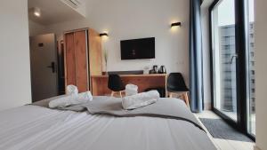 Postel nebo postele na pokoji v ubytování Hotel Konopielka