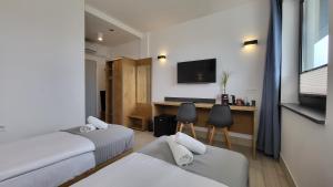 Postel nebo postele na pokoji v ubytování Hotel Konopielka