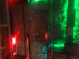 a room with a green and red lights in a building at T's Apartment in Tallinn