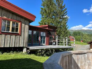 a small cabin with a red roof at Cozy cabin with an amazing view in Åre