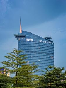 a building with a sign on the side of it at Sofitel Foshan Shunde in Shunde