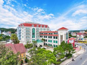 an overhead view of a city with a building at La Sapinette Hotel Dalat in Da Lat