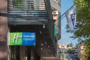 a sign for a harley inn express on the side of a building at Holiday Inn Express - Yerevan, an IHG Hotel in Yerevan