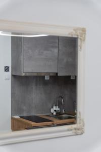 a kitchen with a sink and a stove at Apartmani PARDON in Pag +71 photos
