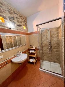 a bathroom with a sink and a shower at Brezza Marina in Scilla