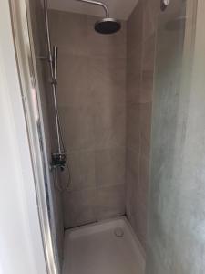 a bathroom with a shower with a toilet at Big Private Room In Town Centre in Eastleigh