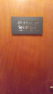 a sign on a wooden door that says permmanent seeland at SebRem in Megève