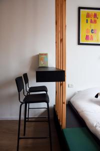 Postel nebo postele na pokoji v ubytování LEVO Urban Studios